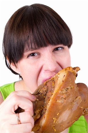 fat people eating at home - The young woman eats  meat Stock Photo - Budget Royalty-Free & Subscription, Code: 400-05333984