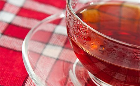 transparent cup of tea on red tablecloth Stock Photo - Budget Royalty-Free & Subscription, Code: 400-05344050