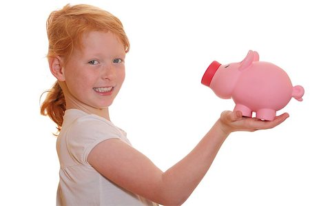 Portrait of a funny smiling red haired girl holding her piggy bank Stock Photo - Budget Royalty-Free & Subscription, Code: 400-05344179