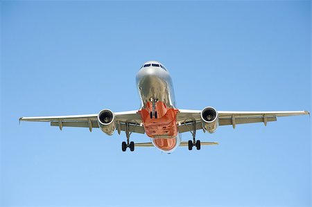 Large passenger airplane flying in the blue sky Photographie de stock - Aubaine LD & Abonnement, Code: 400-05344384