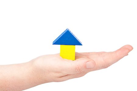 simsearch:400-07774007,k - Female hand holding little house made from wooden toy blocks Foto de stock - Royalty-Free Super Valor e Assinatura, Número: 400-05344627