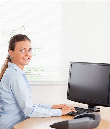 simsearch:400-04894274,k - Businesswoman typing on a keyboard in an office Stock Photo - Budget Royalty-Free & Subscription, Code: 400-05345156