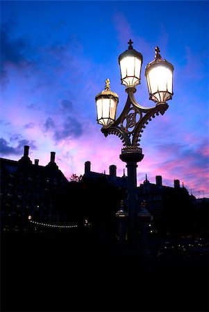 electricity pole silhouette - beautiful romantic street lamp at sunset in London Foto de stock - Super Valor sin royalties y Suscripción, Código: 400-05345349