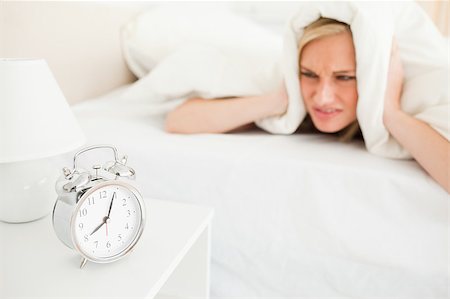 simsearch:6109-06194402,k - Displeased cute woman waking up in her bedroom Stock Photo - Budget Royalty-Free & Subscription, Code: 400-05345899