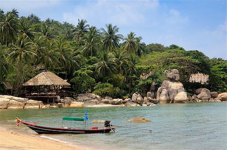 longtail boat on beach in front of resort built into the rock formations and jungle of koh tao in the gulf of thailand Stock Photo - Budget Royalty-Free & Subscription, Code: 400-05346329