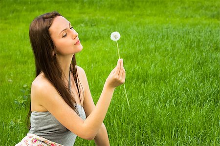 fun park mouth - Girl with dandelion on the green field Stock Photo - Budget Royalty-Free & Subscription, Code: 400-05346913
