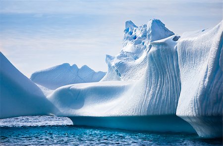 simsearch:400-05383454,k - Antarctic iceberg in the snow. Beautiful winter background. Foto de stock - Royalty-Free Super Valor e Assinatura, Número: 400-05346925