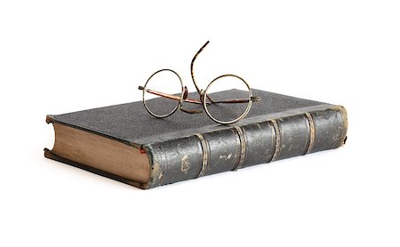 simsearch:400-06772771,k - Vintage spectacles lying on old book on white background Photographie de stock - Aubaine LD & Abonnement, Code: 400-05347199