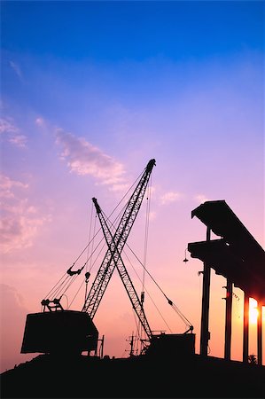 shipyard boat construction - Silhouette of several cranes working at sunset in a harbor Stock Photo - Budget Royalty-Free & Subscription, Code: 400-05347340