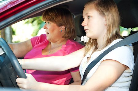 Teenage driver and her mother about to have a car accident. Stock Photo - Budget Royalty-Free & Subscription, Code: 400-05347529