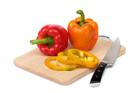 rote paprika - colorful peppers on board isolated on white Foto de stock - Super Valor sin royalties y Suscripción, Código: 400-05348274