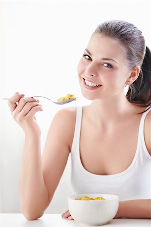 Young attractive girl at breakfast Stock Photo - Budget Royalty-Free & Subscription, Code: 400-05348878