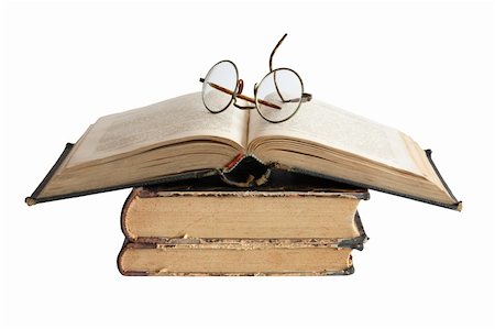 simsearch:400-06772771,k - Vintage spectacles lying on old books. Isolated on white background with clipping path Photographie de stock - Aubaine LD & Abonnement, Code: 400-05349054