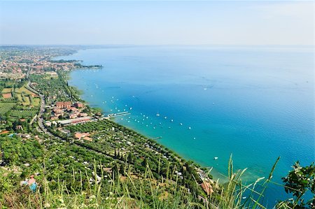 riva - View to the south-east part of Garda lake from the high mountain in one beautiful day of summer Fotografie stock - Microstock e Abbonamento, Codice: 400-05349102