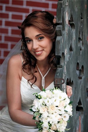 The beautiful bride with bouquet in park Stock Photo - Budget Royalty-Free & Subscription, Code: 400-05349118