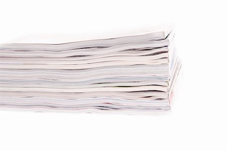 simsearch:400-05901369,k - Closeup of a pile of magazines on white background Stock Photo - Budget Royalty-Free & Subscription, Code: 400-05349152