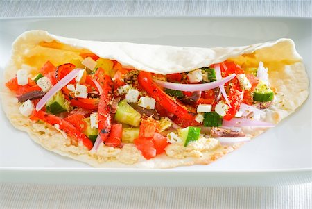 fresh homemade salad wrap on pita bread,very healthy food Foto de stock - Super Valor sin royalties y Suscripción, Código: 400-05349555