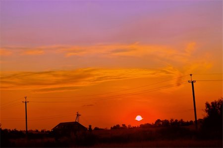 electricity pole silhouette - Sunset over the village, a fine summer evening Foto de stock - Super Valor sin royalties y Suscripción, Código: 400-05349833
