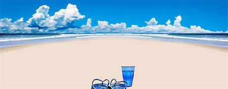 simsearch:400-04874641,k - Tropical beach with beach shoes and blue glass of water Stock Photo - Budget Royalty-Free & Subscription, Code: 400-05340144