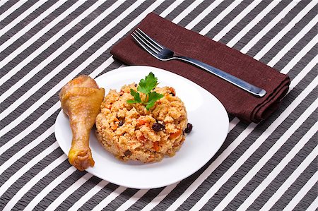 delicious couscous with chicken on a striped background Stock Photo - Budget Royalty-Free & Subscription, Code: 400-05340185