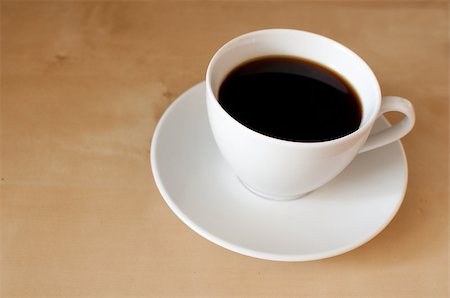 Espresso coffee in white mug on wooden table Foto de stock - Super Valor sin royalties y Suscripción, Código: 400-05340364