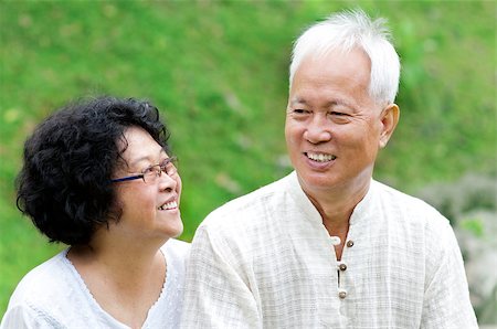 Asian Senior Couple talking at outdoor park Stock Photo - Budget Royalty-Free & Subscription, Code: 400-05340406