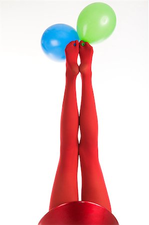 simsearch:400-04308604,k - Female feet in red stockings with balloons isolated in white Stock Photo - Budget Royalty-Free & Subscription, Code: 400-05341356