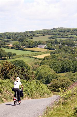 Woman in holidays cycling around Cornwall and Devon Stockbilder - Microstock & Abonnement, Bildnummer: 400-05341447