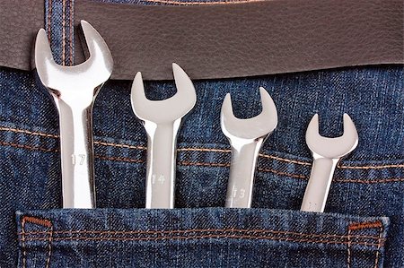 Spanners in jeans pocket close up Stock Photo - Budget Royalty-Free & Subscription, Code: 400-05341856