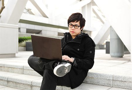 man using computer outdoor Stock Photo - Budget Royalty-Free & Subscription, Code: 400-05342036