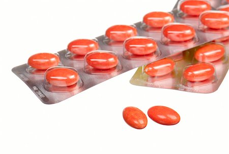 simsearch:700-00051154,k - close up orange capsules and blisters isolated on white Foto de stock - Royalty-Free Super Valor e Assinatura, Número: 400-05342350
