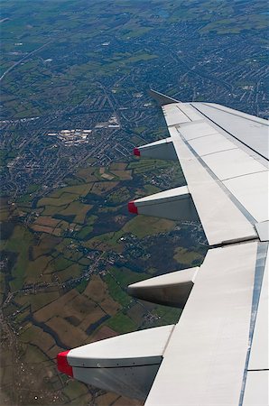 airplane wing detail, flying over countryside, vertical composition Stock Photo - Budget Royalty-Free & Subscription, Code: 400-05342530