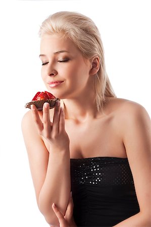 beauty portrait of young woman smelling a strawberry sweet with closed eyes as a dreamer Foto de stock - Super Valor sin royalties y Suscripción, Código: 400-05342901