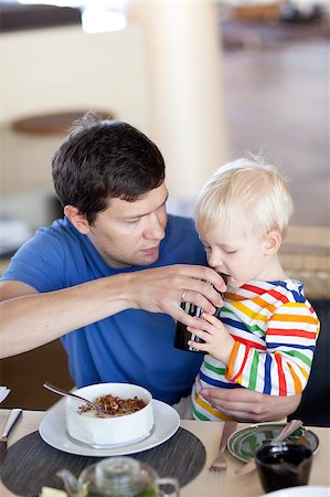 father and his son having delicious breakfast together Stock Photo - Budget Royalty-Free & Subscription, Code: 400-05343345