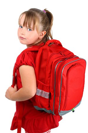 Portrait of pre-teen blonde school girl in red clothes, with her red school bookbag, looking back over her shoulder, isolated on white background Stock Photo - Budget Royalty-Free & Subscription, Code: 400-05343426