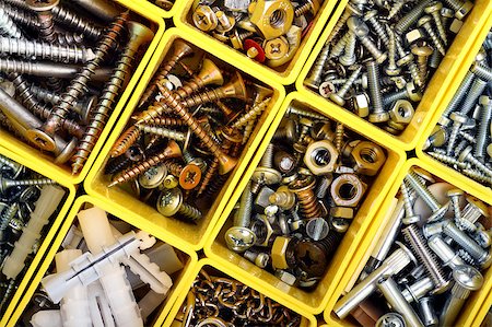 simsearch:6109-08489043,k - Detailed top view of a plastic work tool organizer filled with wood screws, bolts and other carpenter hardware Stock Photo - Budget Royalty-Free & Subscription, Code: 400-05343468