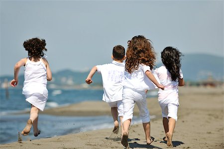 group of happy child on beach who have fun and play games Stock Photo - Budget Royalty-Free & Subscription, Code: 400-05343686
