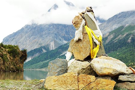 Landscape of prayer rocks at the lakeside in Tibet Stock Photo - Budget Royalty-Free & Subscription, Code: 400-05343952