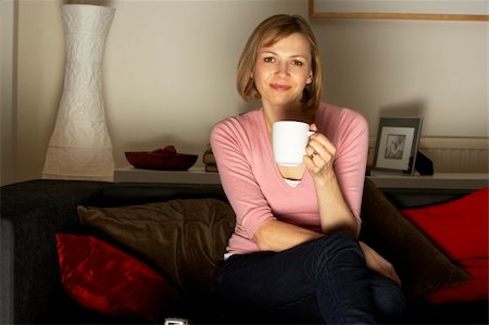 simsearch:400-07716434,k - Woman Relaxing With Cup Of Coffee Watching Television Stockbilder - Microstock & Abonnement, Bildnummer: 400-05354644