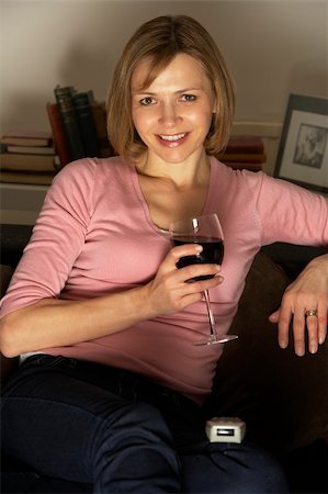 simsearch:400-05195435,k - Woman Relaxing With Glass Of Wine Watching Television Stockbilder - Microstock & Abonnement, Bildnummer: 400-05354647