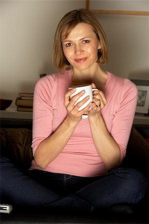 simsearch:400-05195435,k - Woman Relaxing With Cup Of Coffee Watching Television Stockbilder - Microstock & Abonnement, Bildnummer: 400-05354643