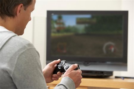 Man Playing With Game Console Photographie de stock - Aubaine LD & Abonnement, Code: 400-05354729