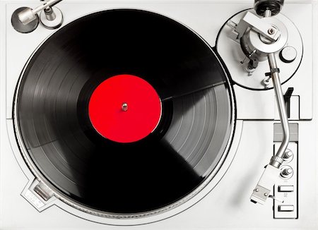 dj turntable - Turntable - dj's vinyl player with a red vinyl disk on it, view from above. Stock Photo - Budget Royalty-Free & Subscription, Code: 400-05354808