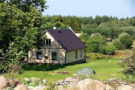 Modern apartment house on a background of a green grass and trees Stock Photo - Budget Royalty-Free & Subscription, Code: 400-05354924