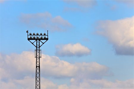 Tall tower with projectors for illumination of stadium Stock Photo - Budget Royalty-Free & Subscription, Code: 400-05355603