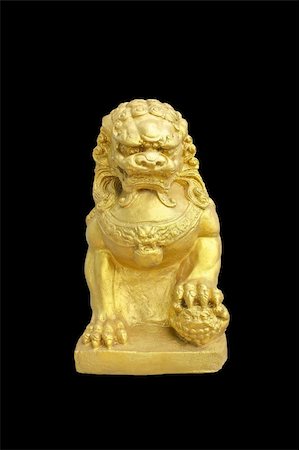simsearch:400-05906247,k - Sculpture of golden female lion holds baby lion on a black ground, symbol of guardian and protection. Stock Photo - Budget Royalty-Free & Subscription, Code: 400-05355628