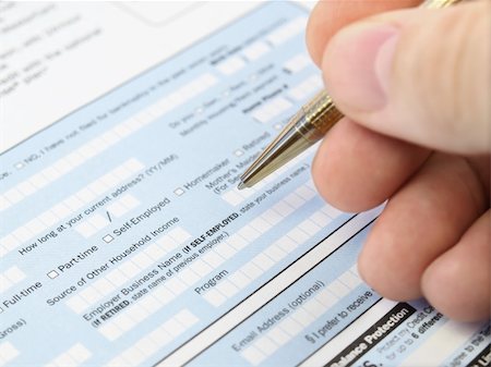 declaring - Man filling out  application form. Stock Photo - Budget Royalty-Free & Subscription, Code: 400-05355758