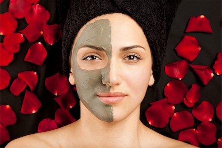 face and cleanse and on person - young beautiful woman having a clay mask on half of her face Stock Photo - Budget Royalty-Free & Subscription, Code: 400-05356188