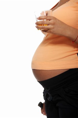 simsearch:600-01374351,k - Pregnant woman holding glass of alcohol ( whiskey ), isolated on white Photographie de stock - Aubaine LD & Abonnement, Code: 400-05356505
