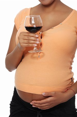 simsearch:600-01374351,k - Pregnant woman holding glass of alcohol ( wine ), isolated on white Photographie de stock - Aubaine LD & Abonnement, Code: 400-05356507